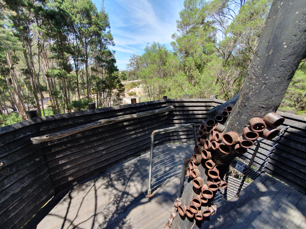 View of the crow's nest top area of the Paperbark Treehouse, including the welded metalwork encircling the tree trunk