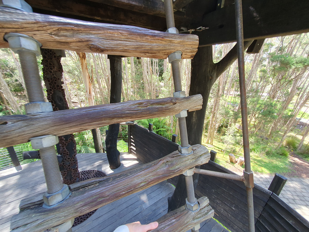 Close detail of the wood and metal step ladder of the paperbark treehouse